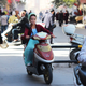 An Ughyur woman on a motorbike in Kashgar, China